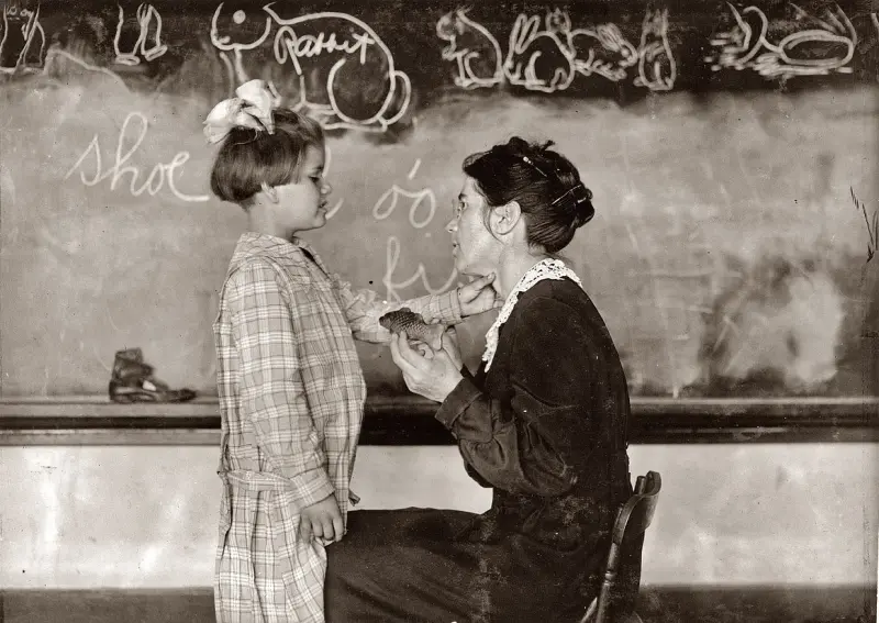 Teaching a deaf-mute to talk.