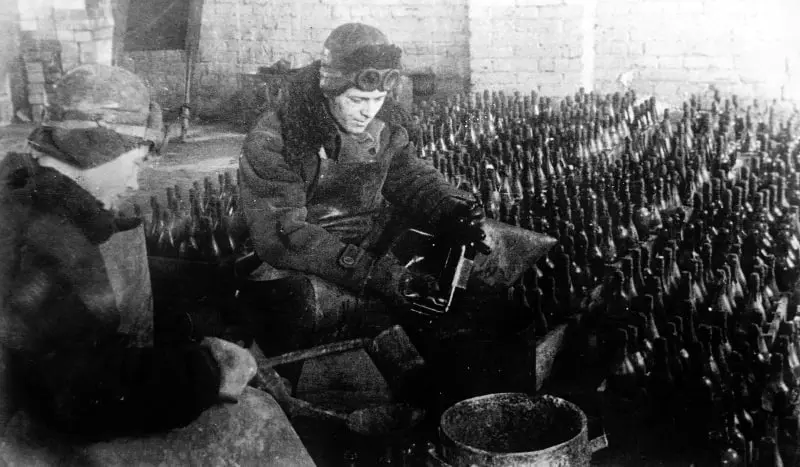 Filling bottles with Molotov cocktail