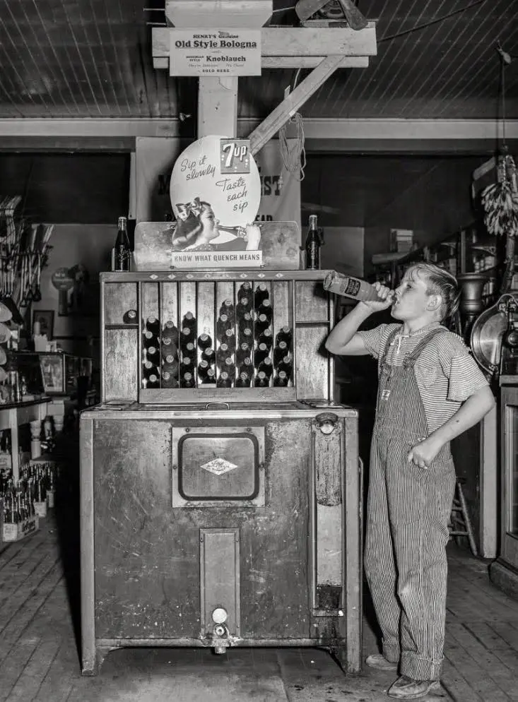 A farm boy drinking soda