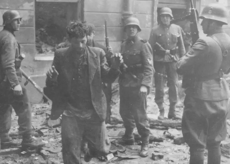 SS troops guarding suspected Jewish resistance fighters