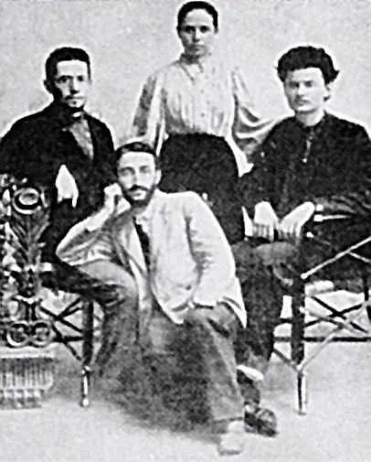 Trotsky's first wife Aleksandra Sokolovskaya with her brother (sitting on the left) and Trotsky (sitting on the right)