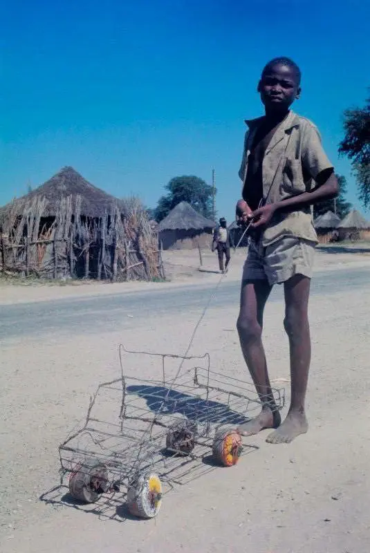 Boy with Make-shift Toy Truck in Maun, Botswana