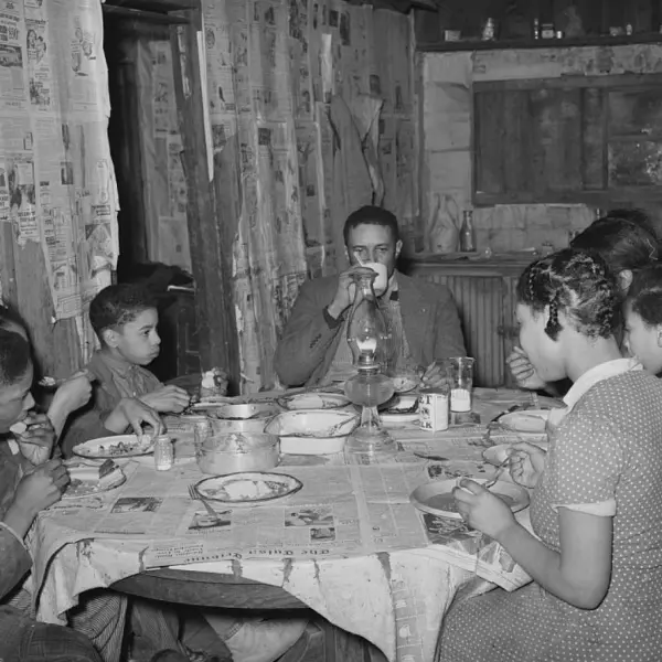 A tenant farmer and his family eating supper