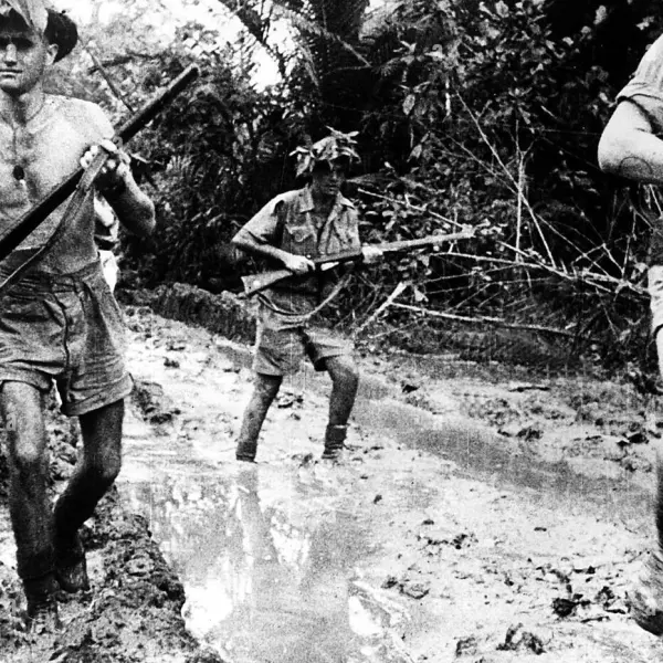 Australian soldiers advancing through mud