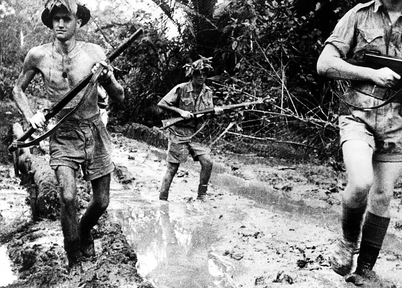 Australian soldiers advancing through mud Australian soldiers advancing through mud