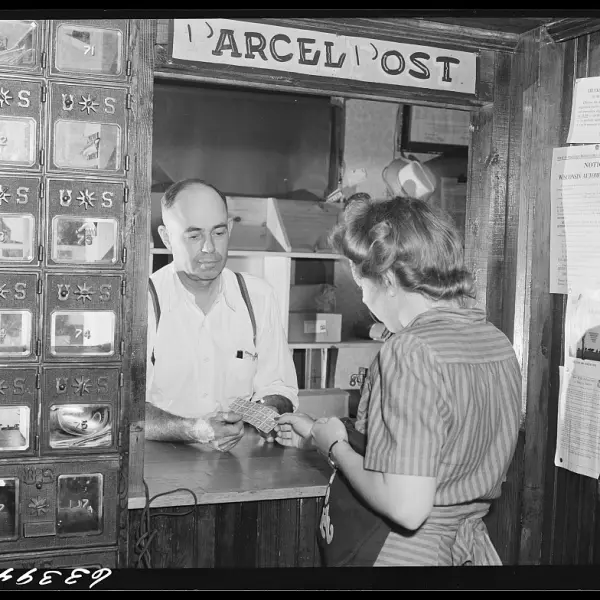 Buying stamps in post office. 