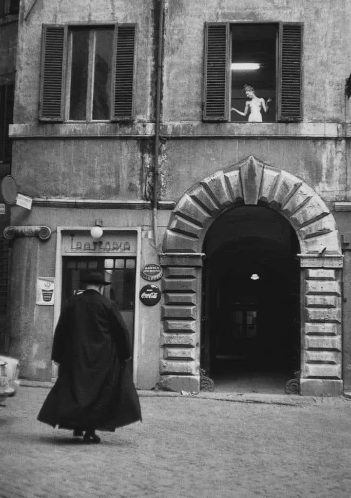 A Priest in Front of a Trattoria