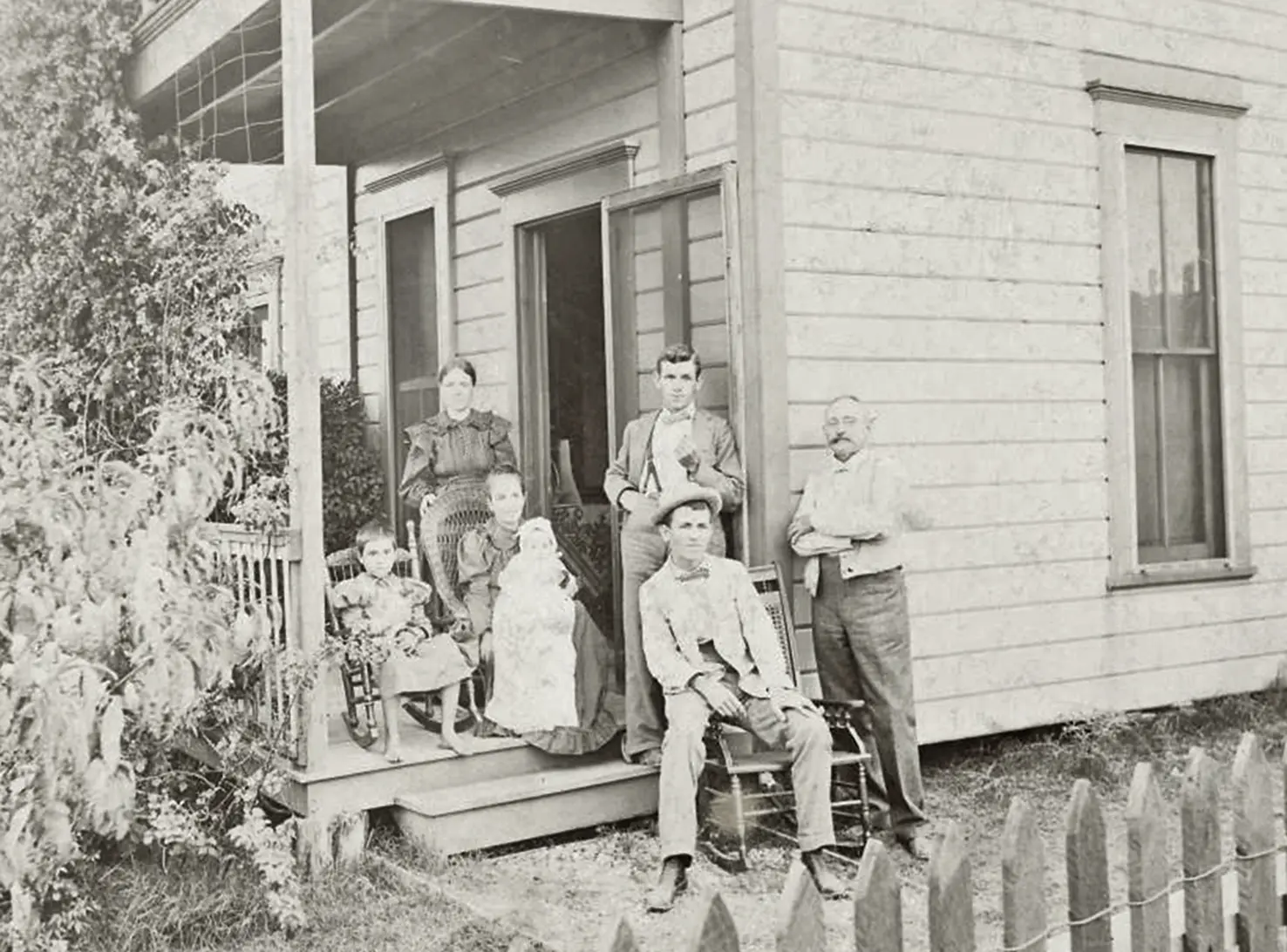 A family outside their home A family outside their home
