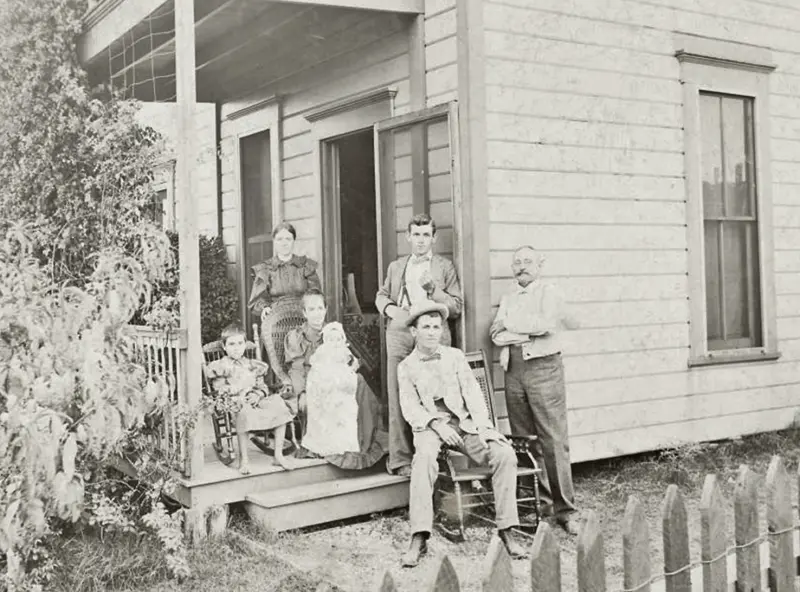 A family outside their home
