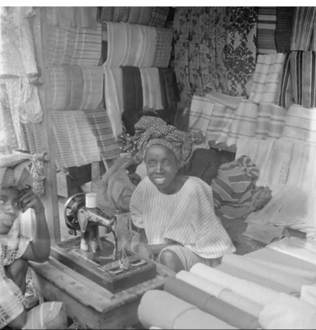 A woman operates a sewing machine