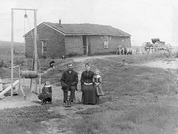 Pioneer Family in Front of Sod House