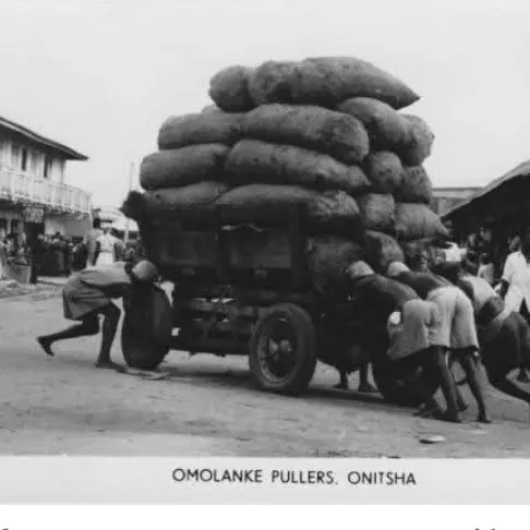 Group men pulling a trader's wagon 