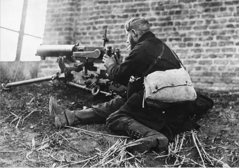 A Belgian soldier smokes a cigarette during a fight between Dendermonde and Oudegem