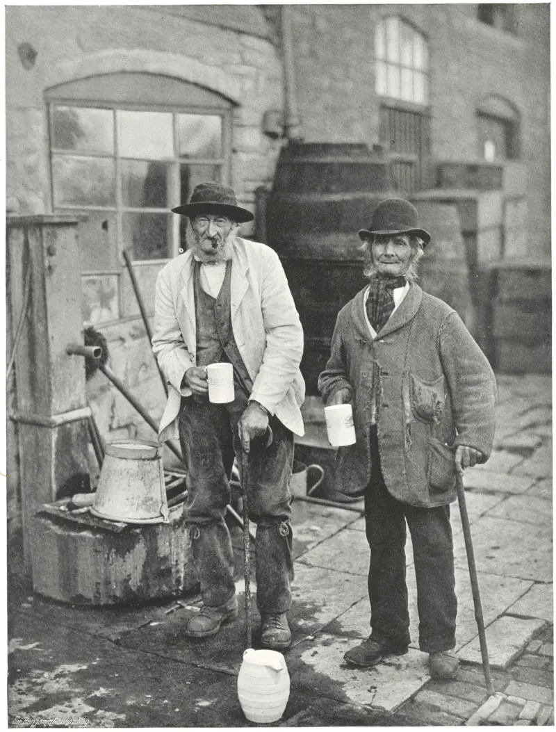 Two villagers drinking at the Bidford Mop annual fair