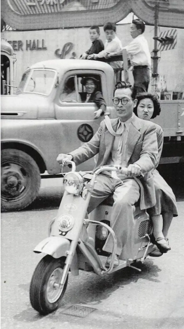 Couple on a scooter. 