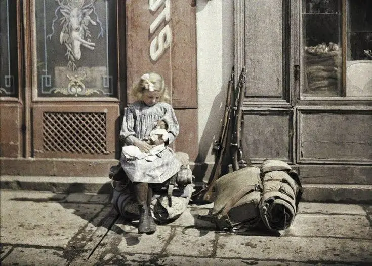 Girl with Doll Near Soldier's Equipment