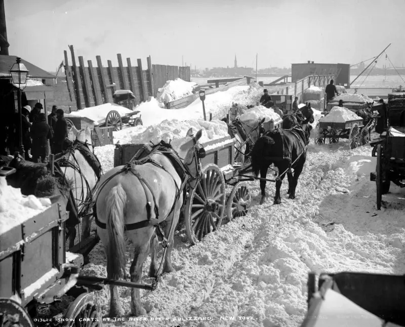 Wagons hauling snow to be dumped into the East River after a major snowstorm