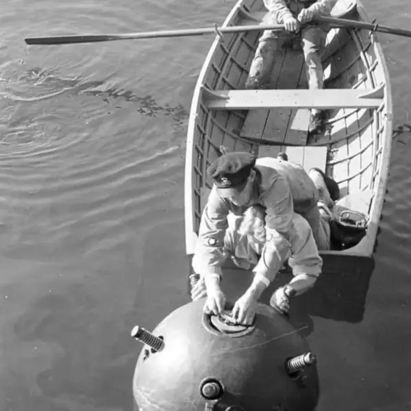 Disarm a floating sea mine