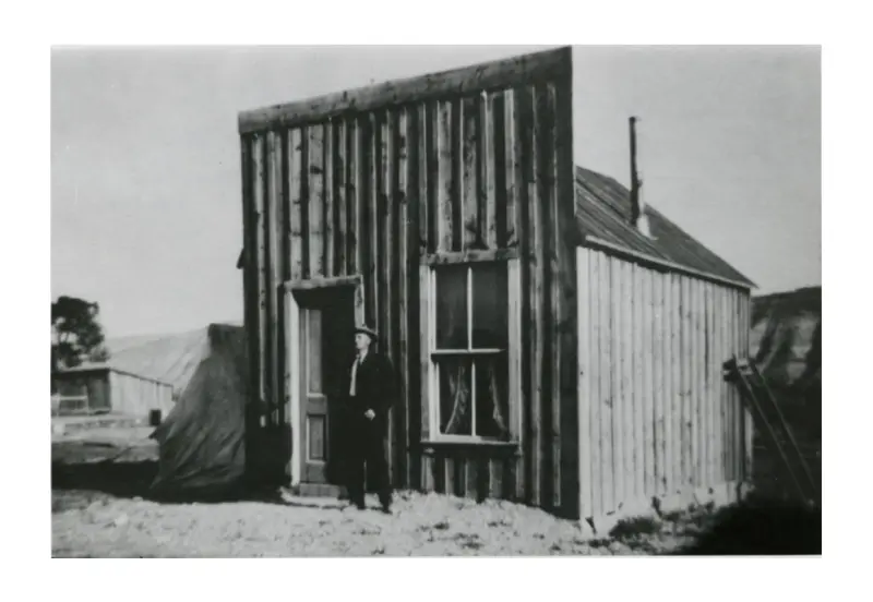 first Justice of the Peace, in front of the first courthouse 