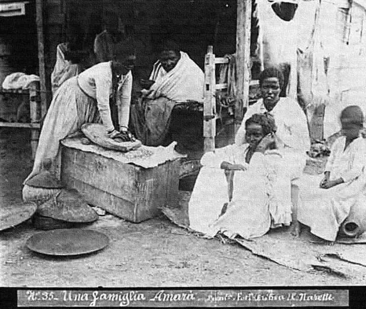 People grinding in stone mills