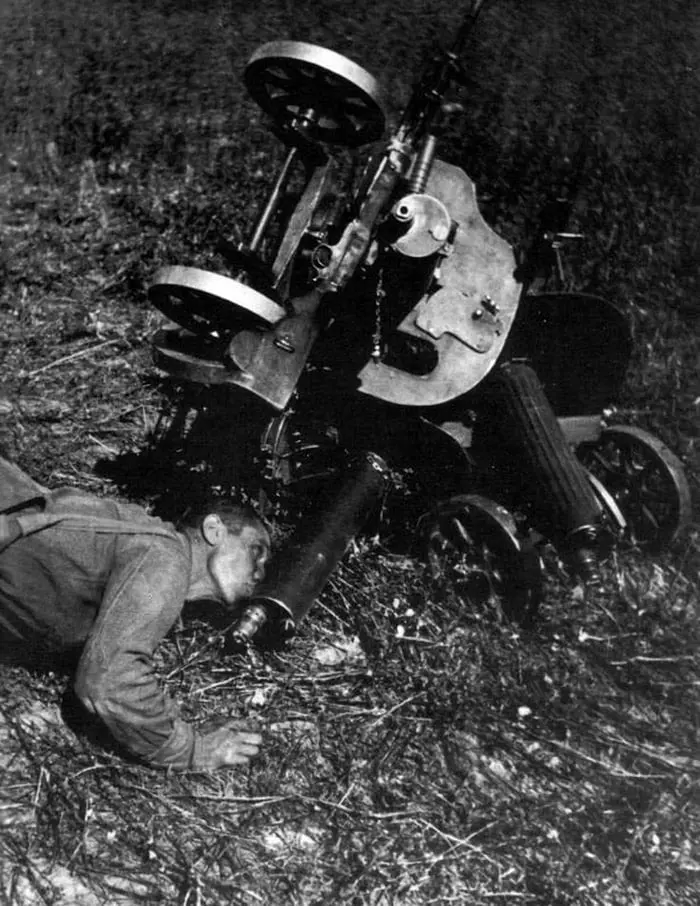 A Red Army Soldier Drinks Water from a Maxim Machine Gun
