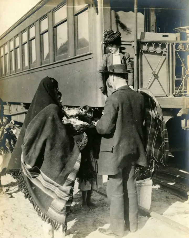 Native American women selling pots,
