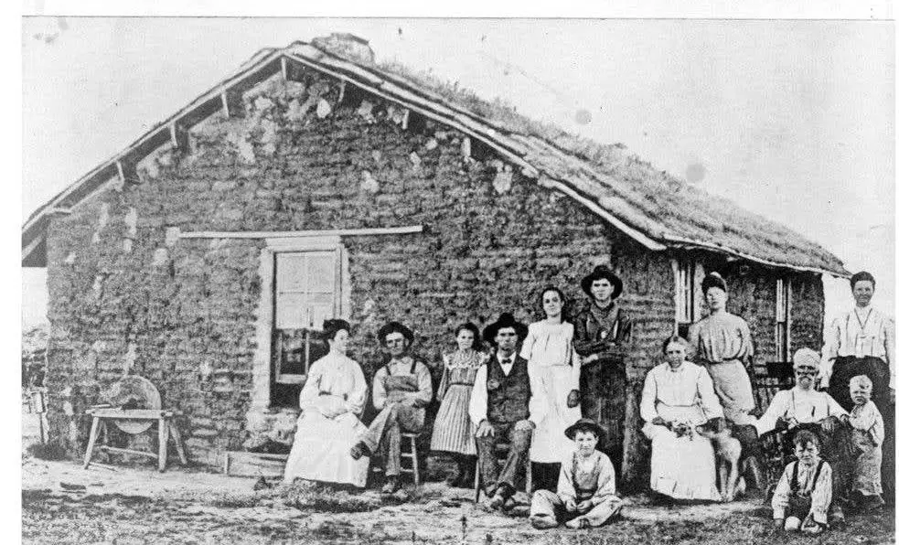 Family in front of a sod house