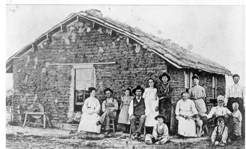 Family in front of a sod house