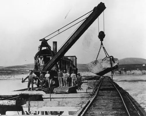 Workers building the breakwater.
